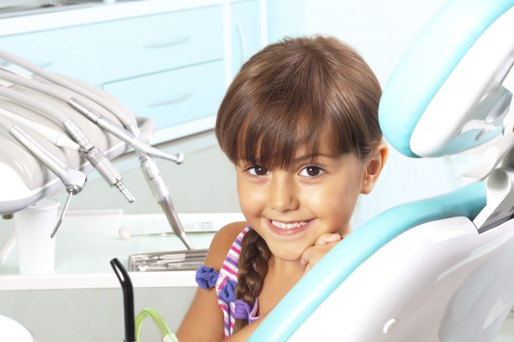Child Smiling at Dentist